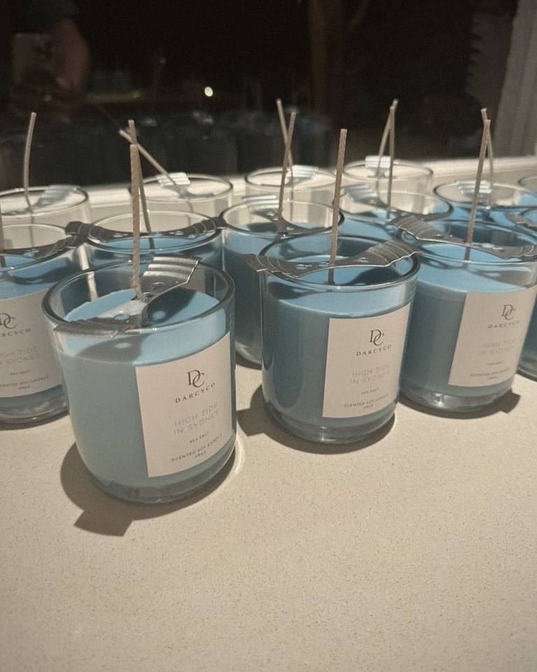 A batch of blue High Tide in Sydney candles setting
